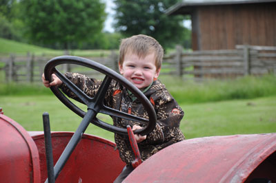 Kids have all kinds of fun on the farm, petting farm animals, driving the tractor, climbing areas and much more at the Downey's Farm in Caledon, Ontario. 